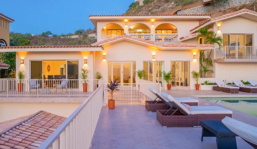 Los Cabos Los Valles Sophisticated and solidly built, this 5,588 sq.ft. estate in Club Campestre offers luxury living with exceptional construction quality rarely found in Los Cabos. Residents enjoy exclusive access to a private beach club and world-class golf course, all just minutes from San Jose vibrant dining and culture. The home features 4 ensuite bedrooms, a 3-stop elevator, and a Generac backup system. Entertain in style with a chef's kitchen, wine room with Tzalam wood cabinetry, and an outdoor BBQ area with fire pit. Relax by the heated pool or on the Jacuzzi terrace with partial ocean – 148 PASEO DE LAS MISIONES, Cabo Corridor, BS